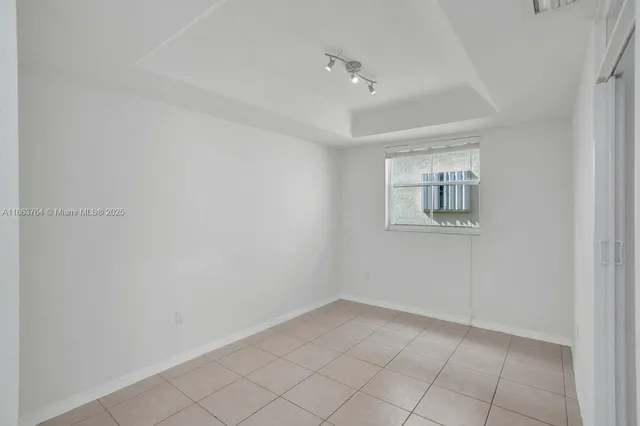 a view of a room with white walls