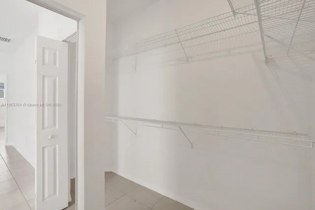 a view of a house with swimming pool and sitting area