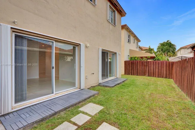 a view of backyard with porch