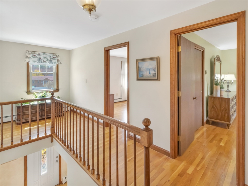 15 Riverside Drive Mansfield, MA 02048 - Photo 14 of 42 a view of a hallway with wooden floor and entryway