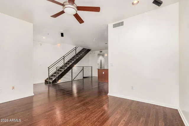 a view of entryway and hall with wooden floor