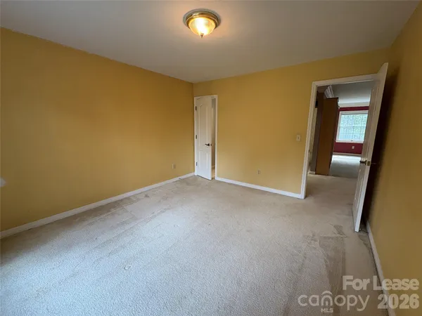 a view of empty room with windows