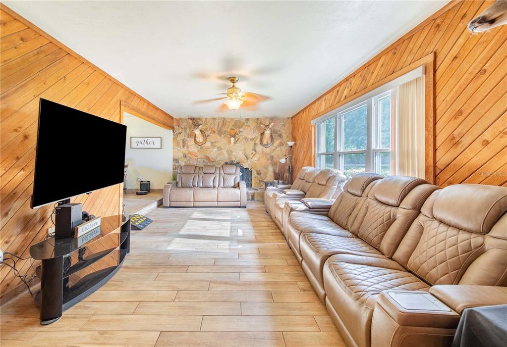 1646 Tyner Road Haines City, FL 33844 - Photo 12 of 64 a living room with furniture and a flat screen tv