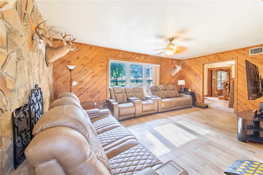 1646 Tyner Road Haines City, FL 33844 - Photo 13 of 64 a living room with furniture and wooden floor