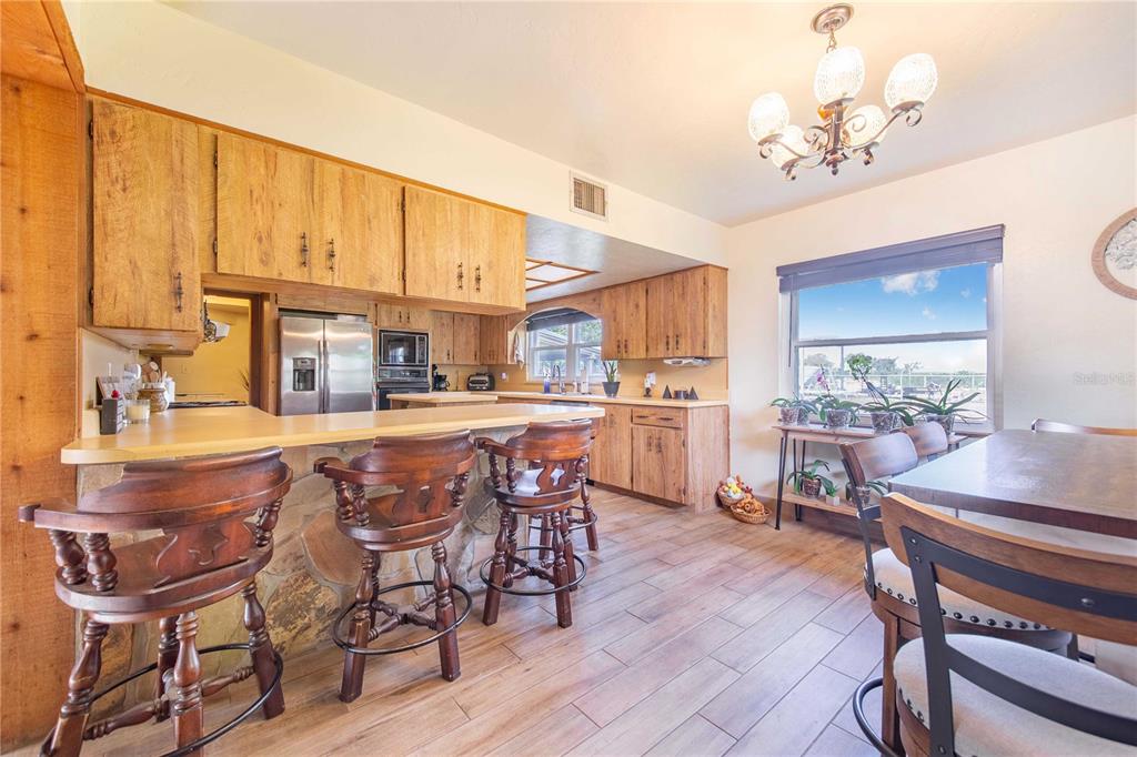 1646 Tyner Road Haines City, FL 33844 - Photo 14 of 64 a dining room with furniture and window