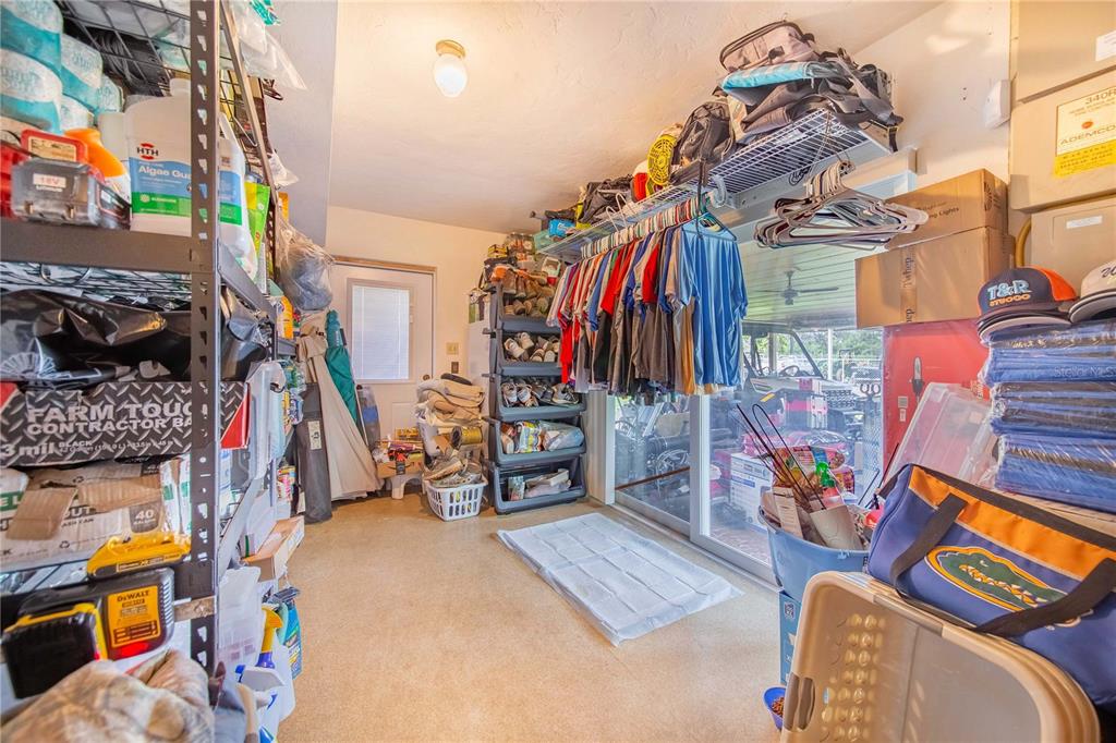1646 Tyner Road Haines City, FL 33844 - Photo 21 of 64 a view of walk in closet with clothes