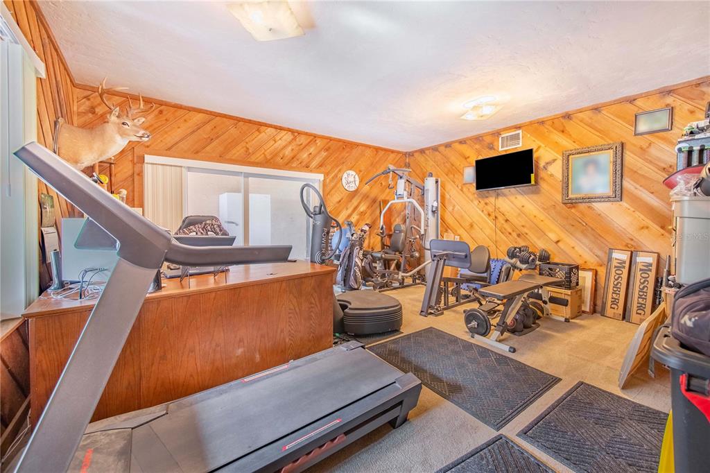 1646 Tyner Road Haines City, FL 33844 - Photo 22 of 64 a living room with furniture stove and a large window