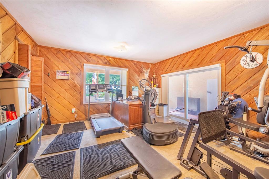 1646 Tyner Road Haines City, FL 33844 - Photo 23 of 64 a living room with furniture and a wooden floor