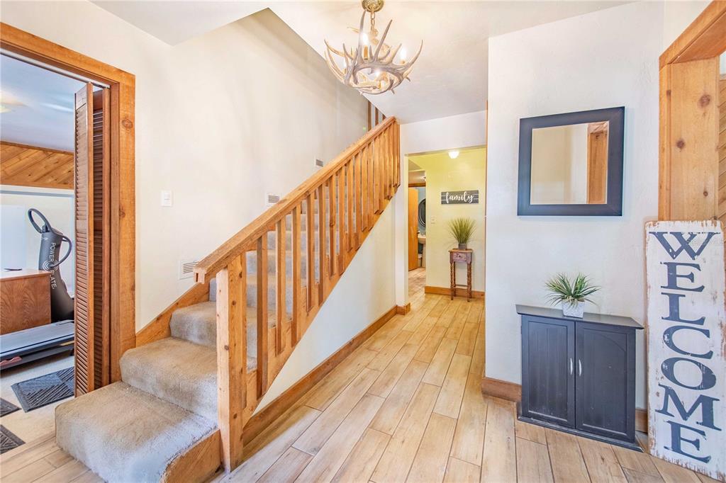 1646 Tyner Road Haines City, FL 33844 - Photo 24 of 64 a view of a hallway with wooden floor and staircase