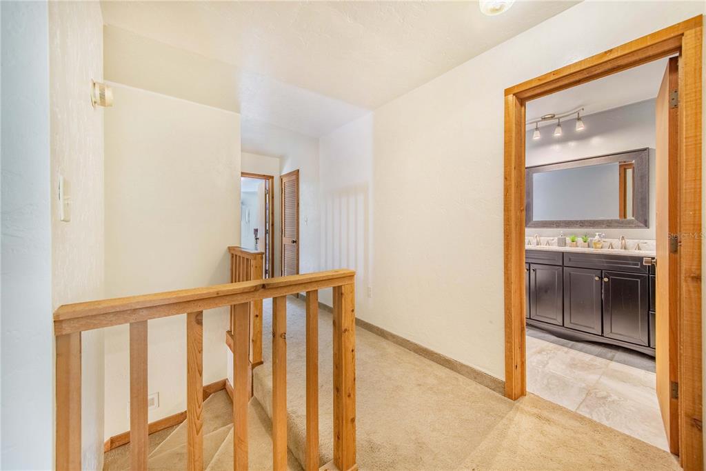 1646 Tyner Road Haines City, FL 33844 - Photo 28 of 64 a view of a hallway with wooden floor and a kitchen