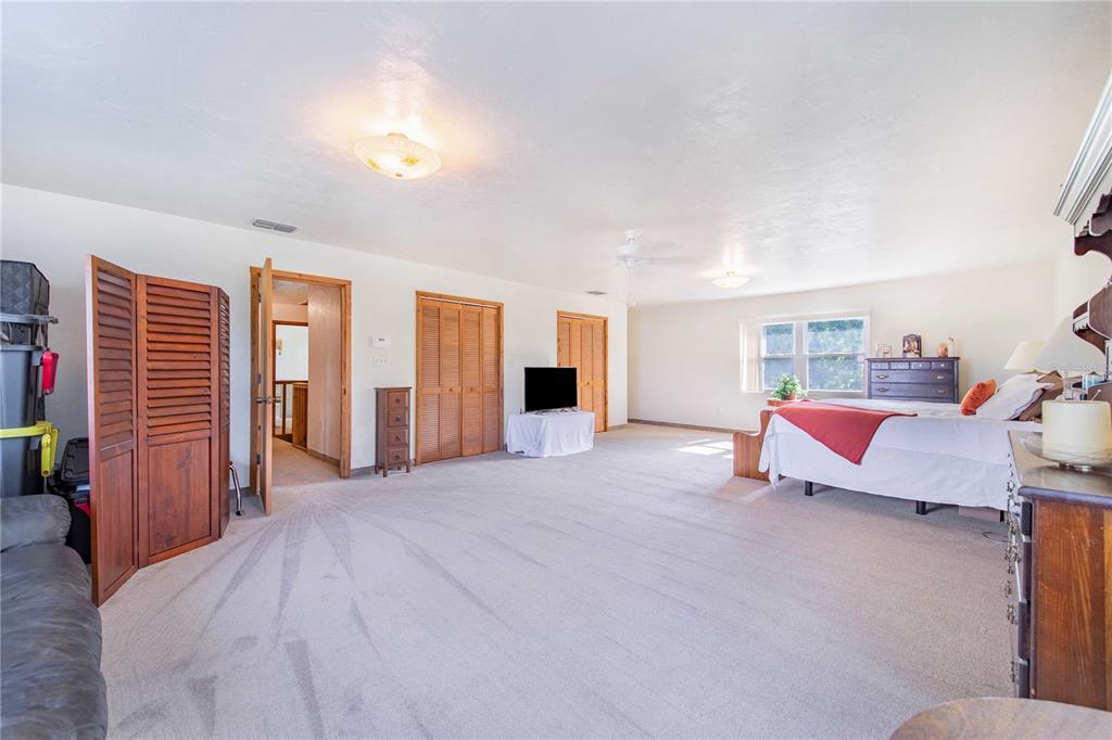 1646 Tyner Road Haines City, FL 33844 - Photo 32 of 64 a bedroom with furniture and window