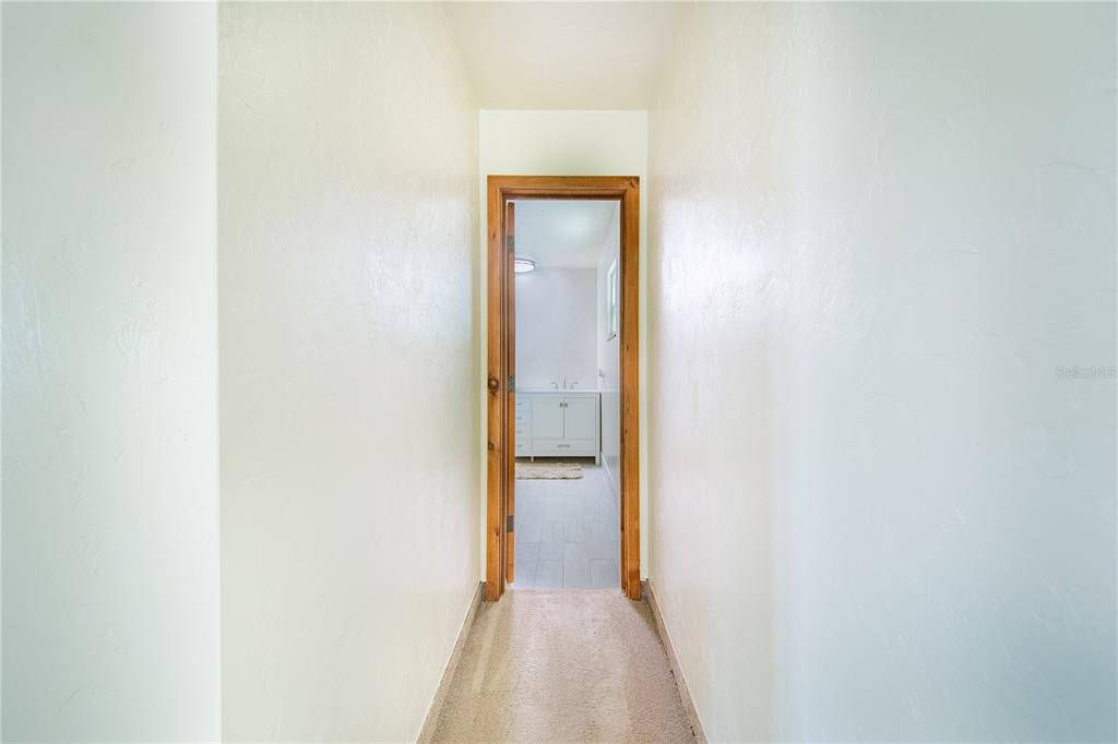 1646 Tyner Road Haines City, FL 33844 - Photo 34 of 64 a view of a hallway with wooden floor