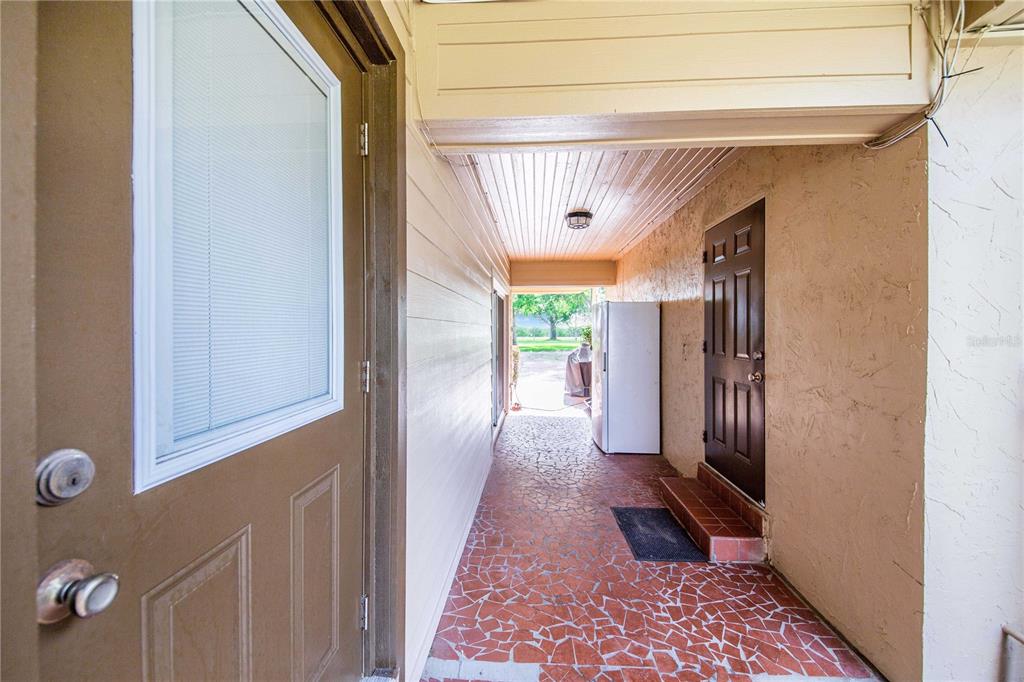 1646 Tyner Road Haines City, FL 33844 - Photo 37 of 64 a hallway with a door and a rug