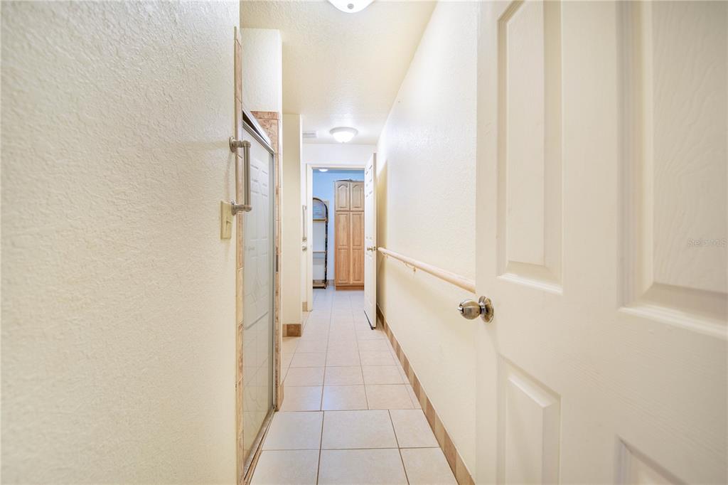1646 Tyner Road Haines City, FL 33844 - Photo 40 of 64 a view of a hallway with a white walls and stairs