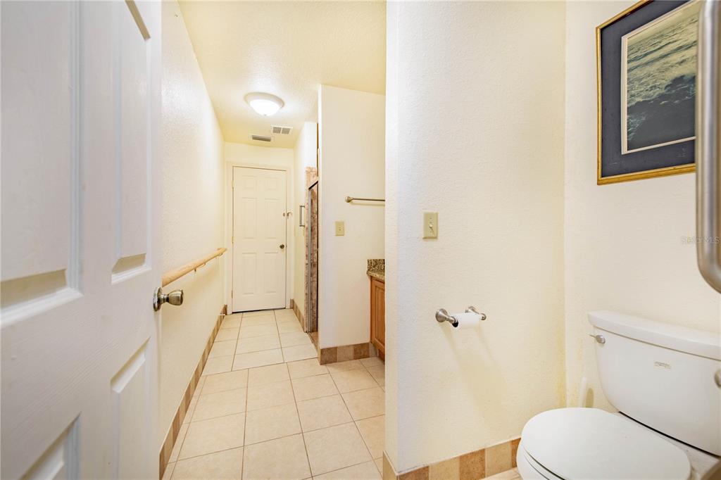 1646 Tyner Road Haines City, FL 33844 - Photo 43 of 64 a bathroom with a granite countertop shower and a toilet