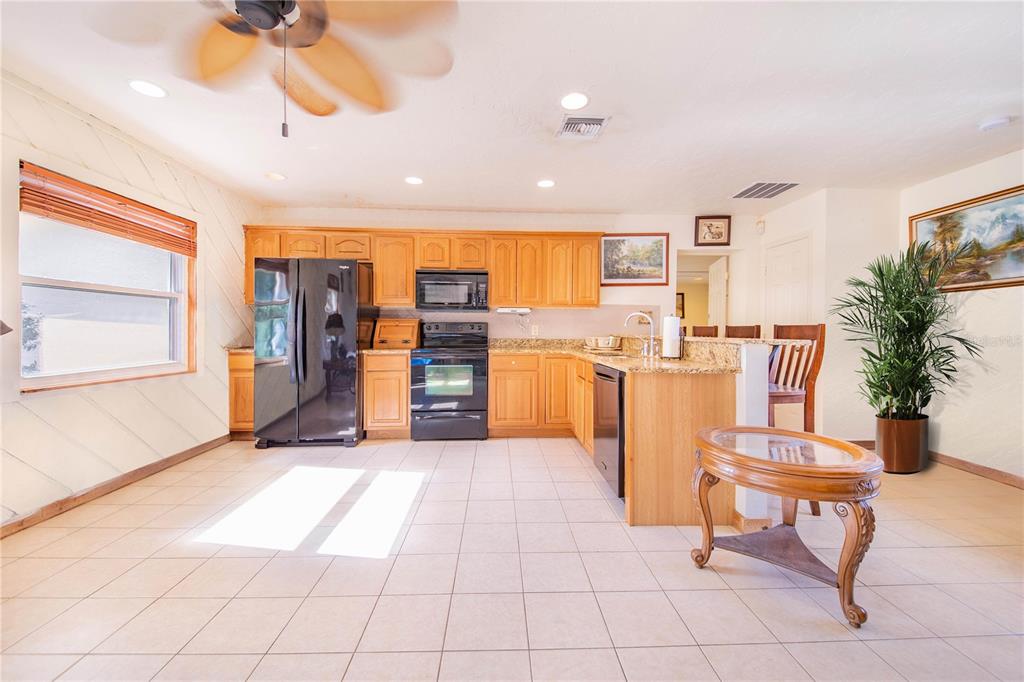 1646 Tyner Road Haines City, FL 33844 - Photo 46 of 64 a living room with furniture a dining table and chairs