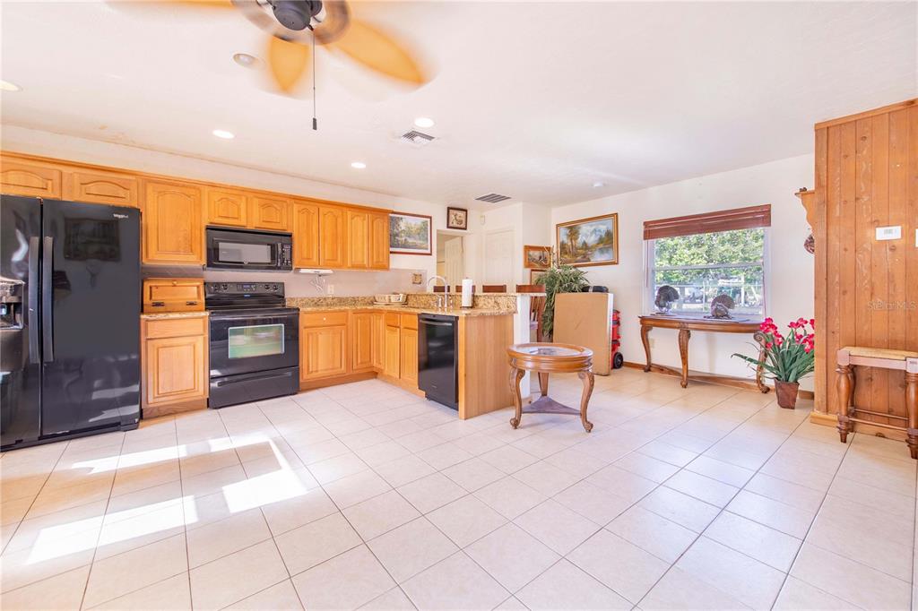 1646 Tyner Road Haines City, FL 33844 - Photo 48 of 64 a view of a kitchen with furniture and a kitchen