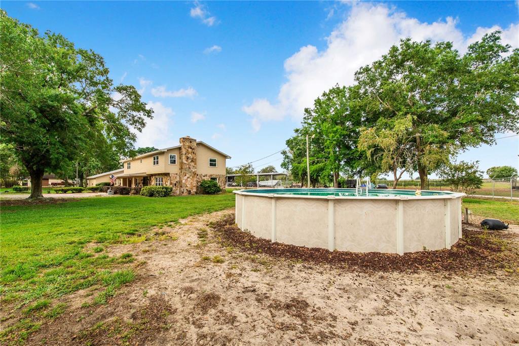 1646 Tyner Road Haines City, FL 33844 - Photo 51 of 64 a view of a house with a yard