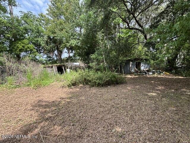 85336 Crews Road North Fernandina Beach, FL 32034 - Photo 6 of 8 a view of a road with trees in the background