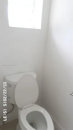 a bathroom with a sink a toilet and bathtub