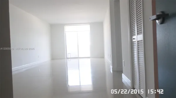 a view of hallway with closet