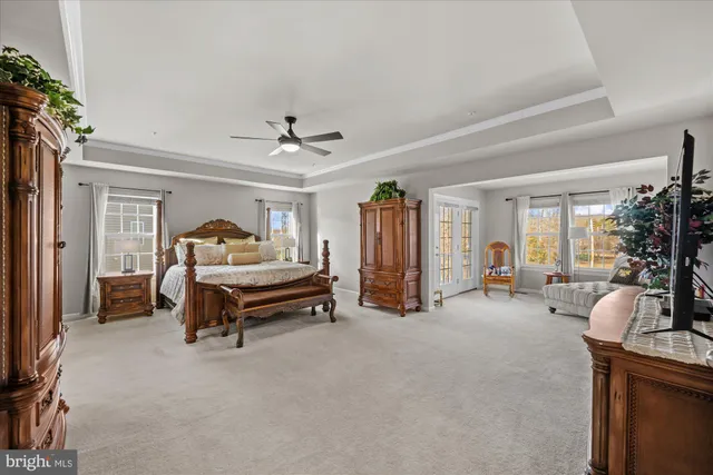 a bedroom with furniture and a chandelier