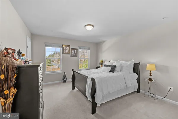 a bedroom with a bed and a table