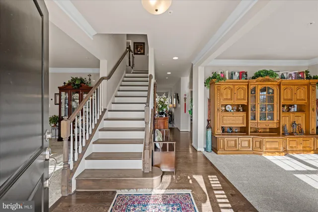 a view of an entryway with wooden floor