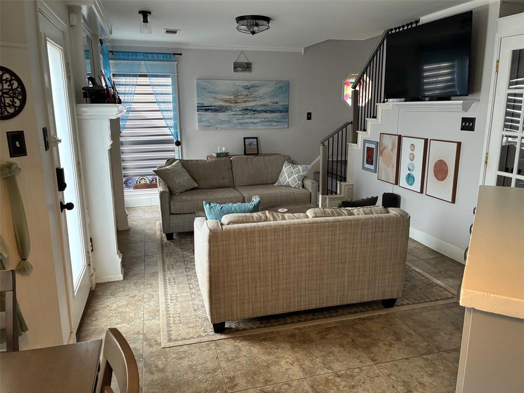 11607 Harbor Road Frisco, TX 75035 - Photo 2 of 10 a living room with furniture and a flat screen tv