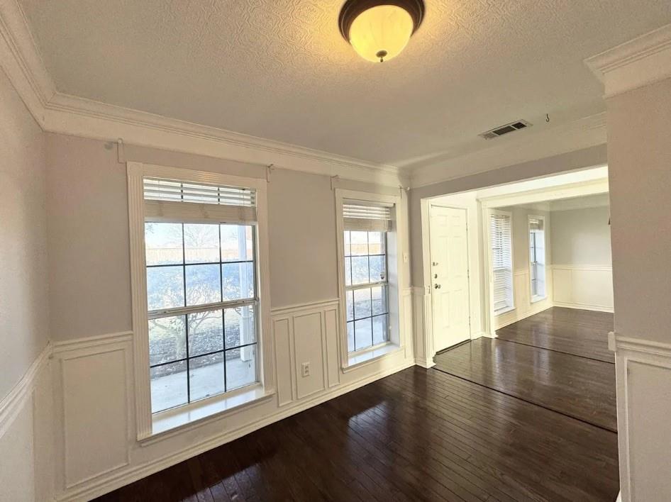 11607 Harbor Road Frisco, TX 75035 - Photo 5 of 10 an empty room with wooden floor and windows