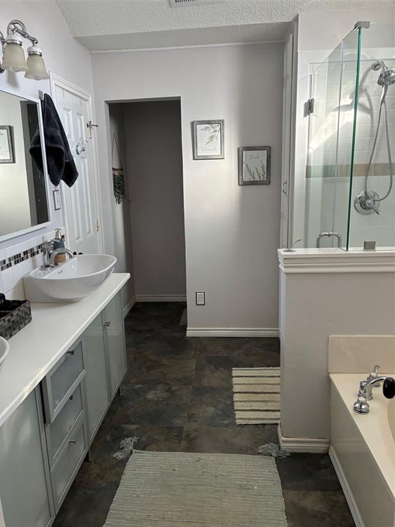 11607 Harbor Road Frisco, TX 75035 - Photo 10 of 10 a bathroom with a sink and a mirror