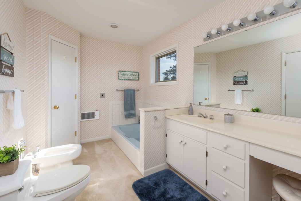 73 B Swoope Road Swoope, VA 24479 - Photo 32 of 75 a spacious bathroom with a double vanity sink toilet and shower