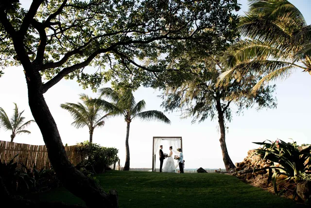 a view of white house with a yard