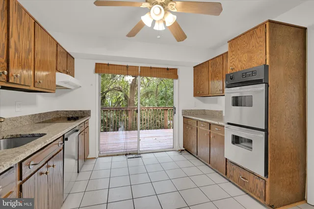 a kitchen with a stove a sink and a microwave
