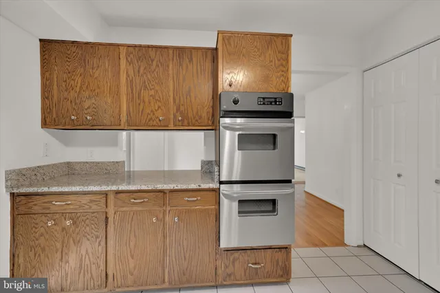 a kitchen with granite countertop a stove and a sink