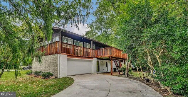 a view of house with yard and entertaining space