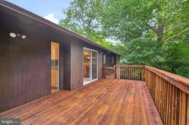 a balcony with trees in front of it