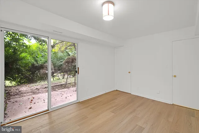 a view of a room with wooden floor and walls