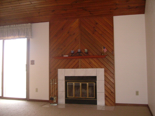 3707 Cutty Sark Road Cherry Valley, IL 61016 - Photo 3 of 6 a living room with a fireplace