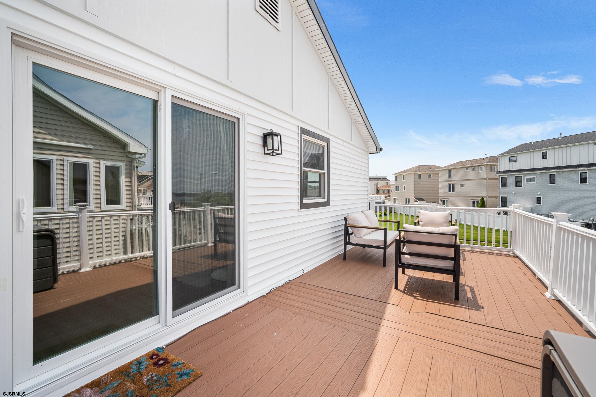 5217 Seaspray Road Brigantine, NJ 08203 - Photo 12 of 35 a balcony with furniture and outdoor view