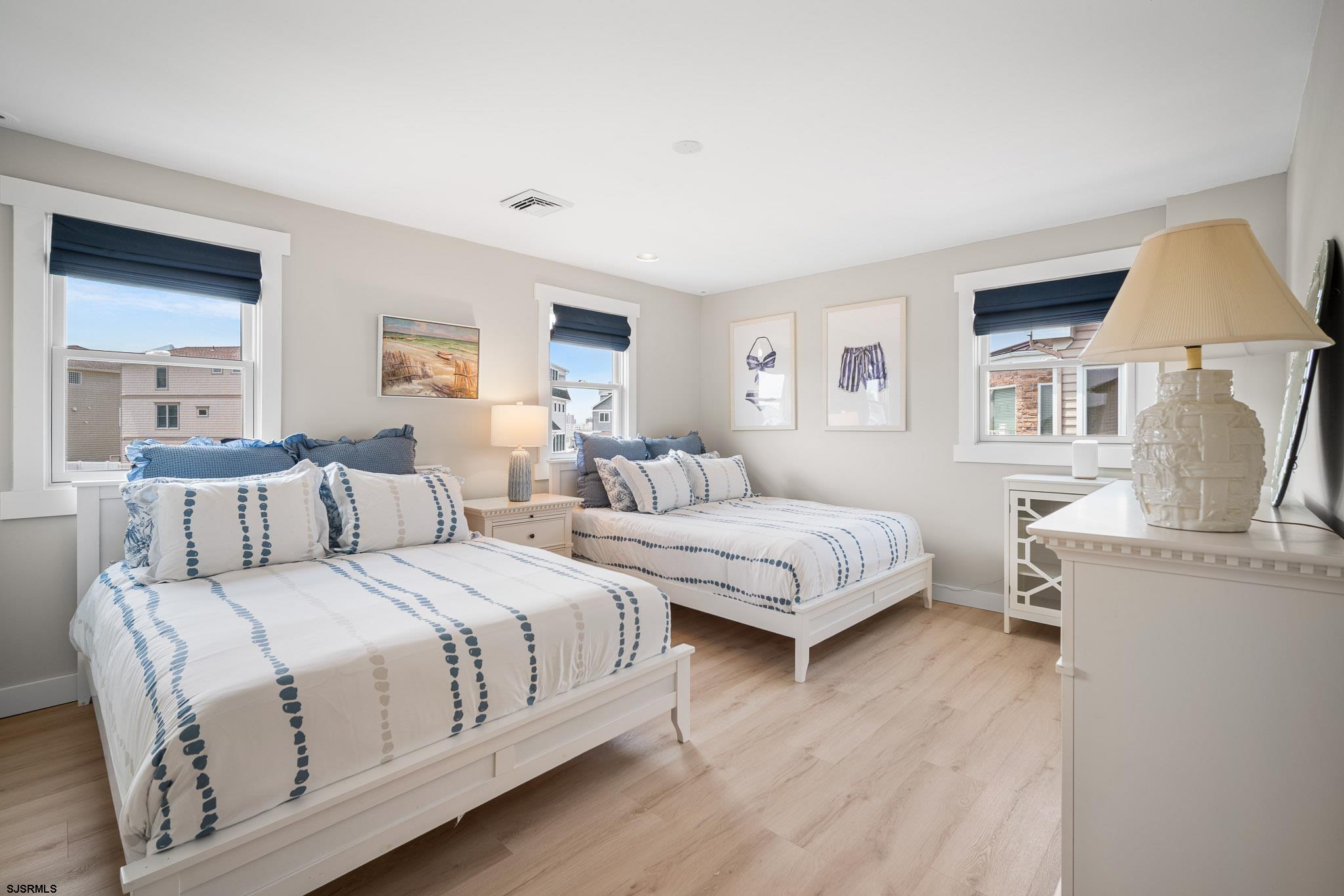 5217 Seaspray Road Brigantine, NJ 08203 - Photo 15 of 35 a large white bed in a white room
