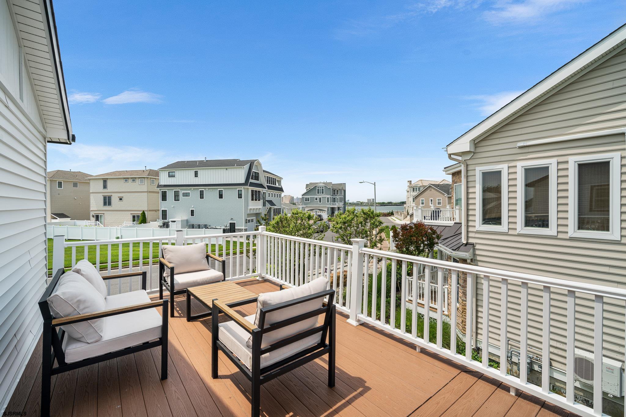 5217 Seaspray Road Brigantine, NJ 08203 - Photo 22 of 35 a roof deck with a table and chairs
