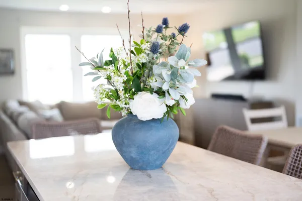 a vase of flowers sitting on a table