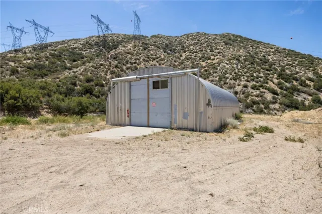 a view of a yard covered with snow in front of house