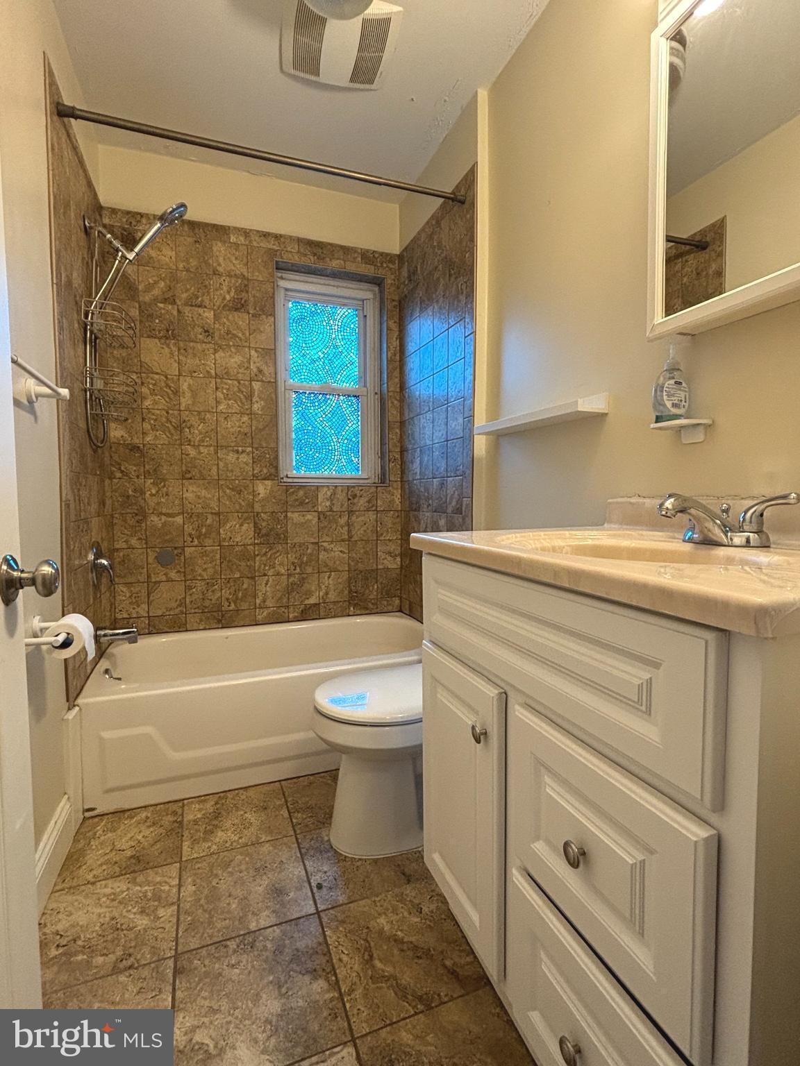 207 New Jersey Road Brooklawn, NJ 08030 - Photo 12 of 14 a bathroom with a sink a toilet and a bathtub