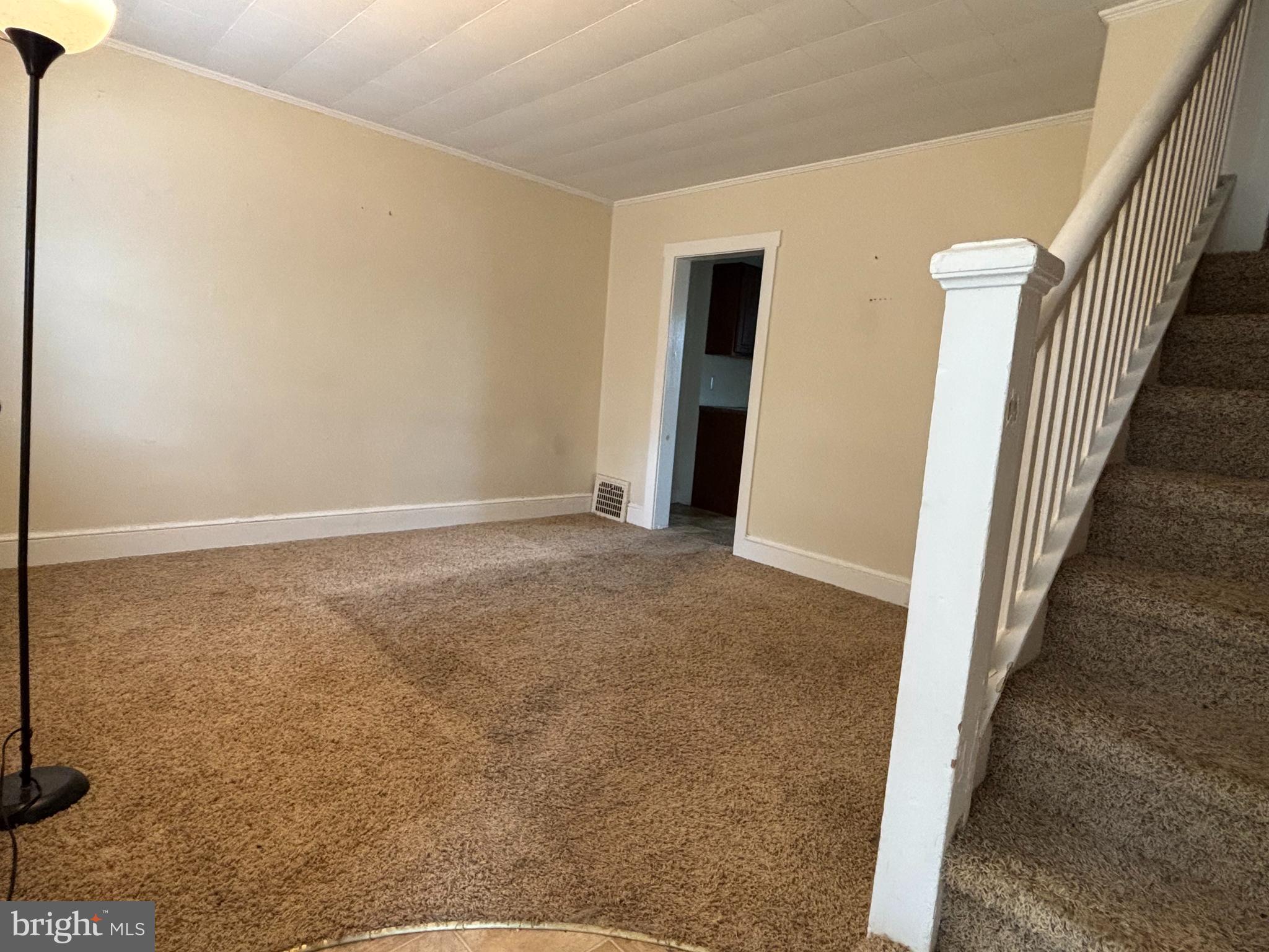 207 New Jersey Road Brooklawn, NJ 08030 - Photo 6 of 14 a view of an empty room with wooden floor