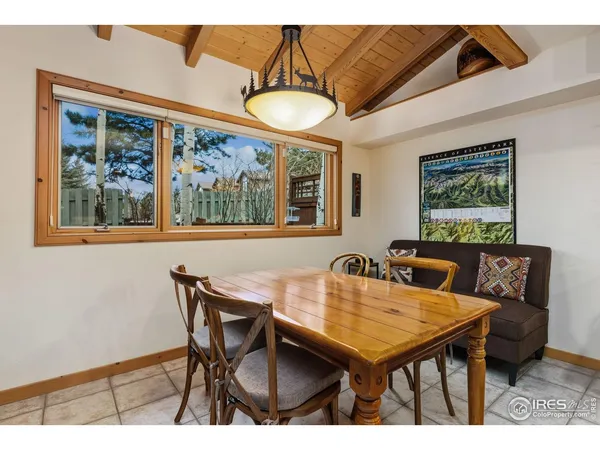 a kitchen with kitchen island granite countertop a sink cabinets and stainless steel appliances