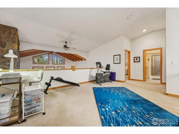 a bedroom with a bed window and couch