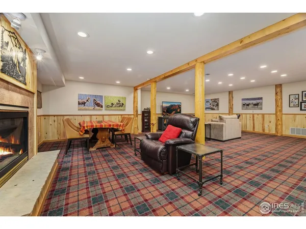 a backyard of a house with barbeque oven table and chairs