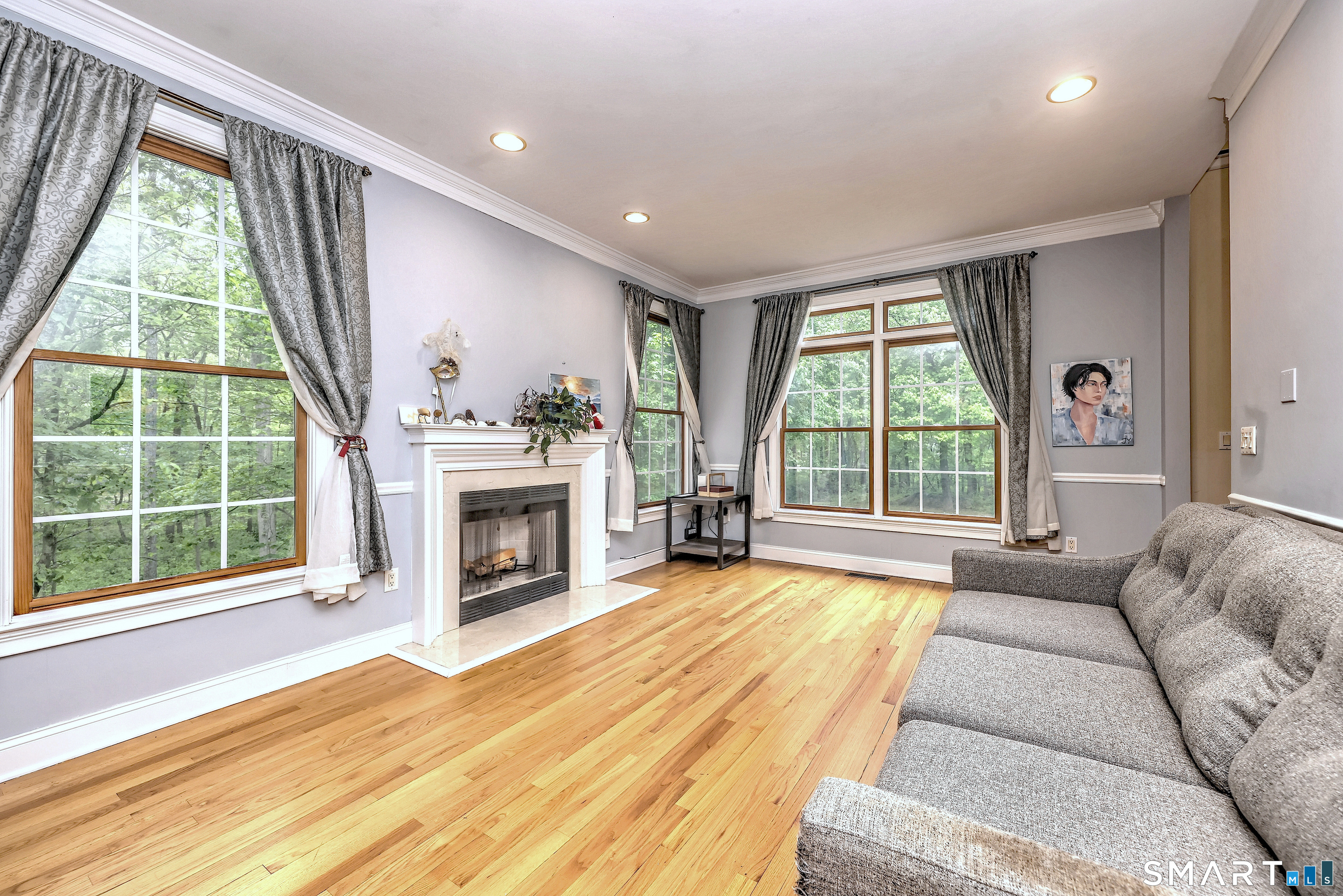125 Peck Hill Road Woodbridge, CT 06525 - Photo 7 of 40 a living room with furniture and a fireplace